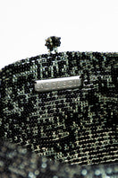 Inside view of SAC DE SOUL Nina top handle bag in black, white, purple, and green with colorful interior details.