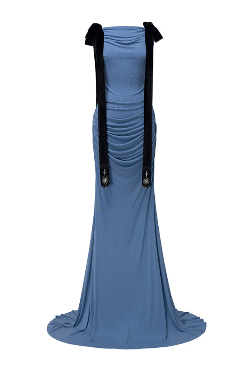 Jenny K Tran Islington Blue gown displayed on a hanger, showcasing its elegant design and vibrant blue fabric.