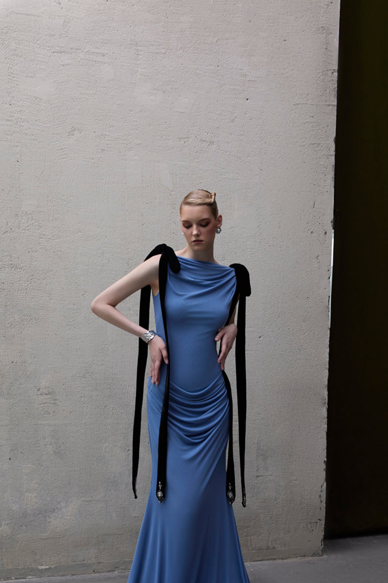 Jenny K Tran Islington blue gown featuring elegant fabric and a flowing silhouette, perfect for formal occasions.