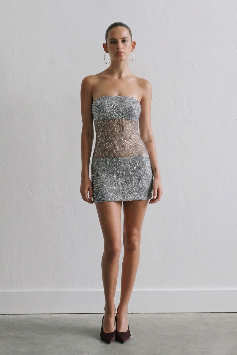 Silver sequin Lisa dress by ILA, mini dress with shimmering fabric and fitted design, perfect for evening events.