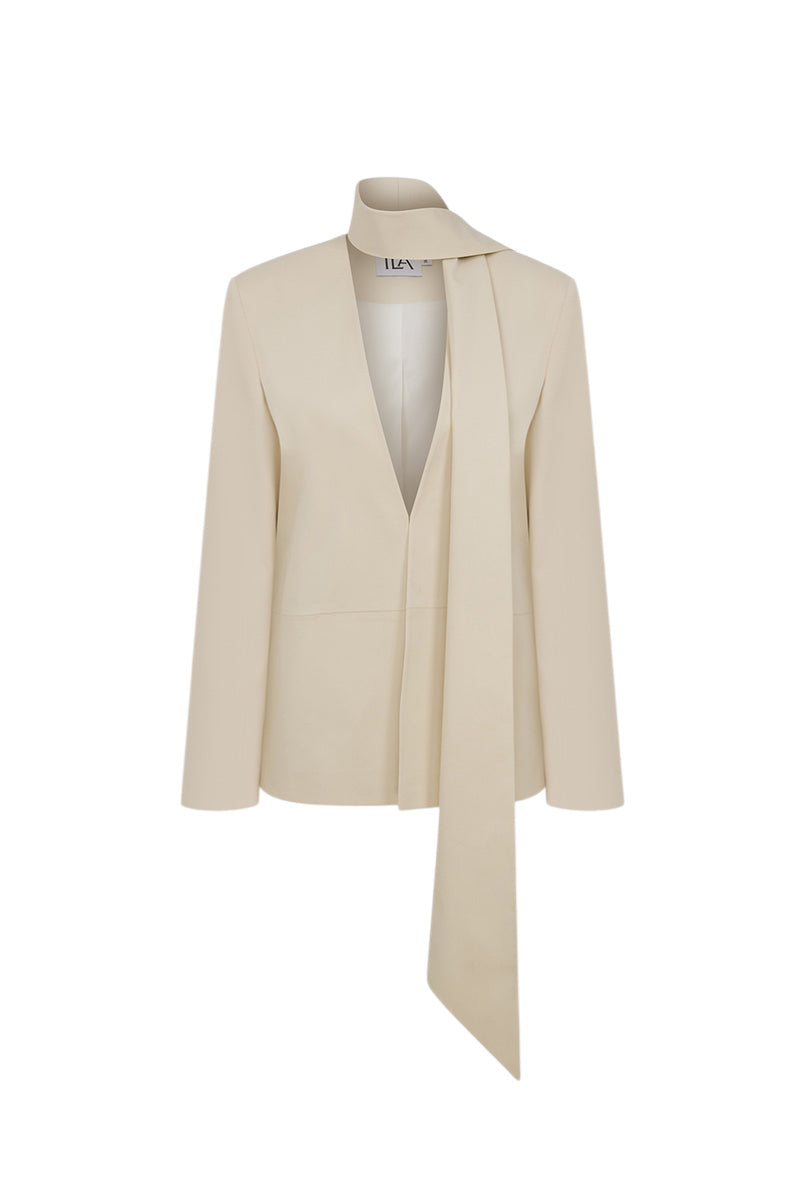 Ila ANNY blazer in seashell ecru, tailored fit with lapel collar and button front, displayed on a hanger.