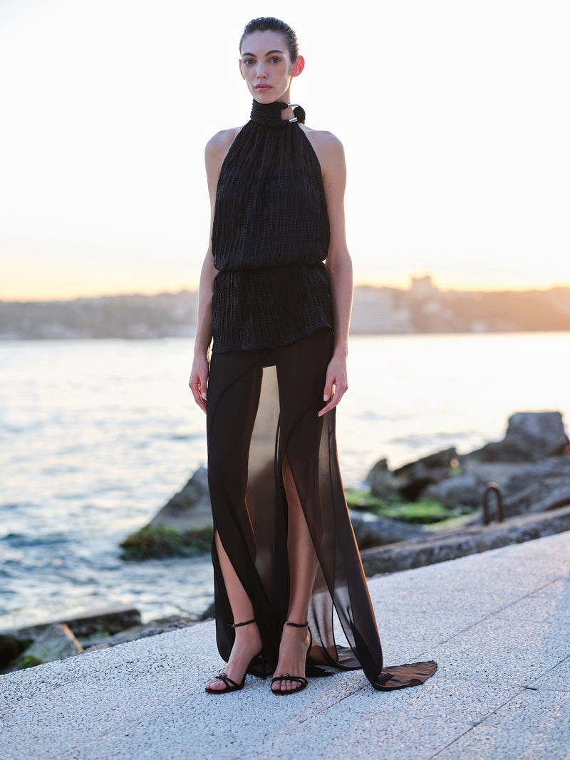 Black Joyce mini dress by ILA, stylish sleeveless dress with a fitted silhouette, perfect for casual or evening wear.