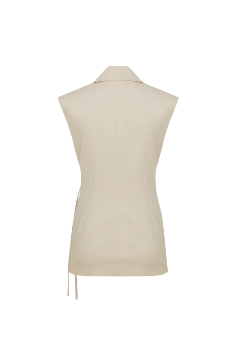 Back view of ILA Alina vest in seashell ecru, featuring soft fabric and stylish design, perfect for layering.