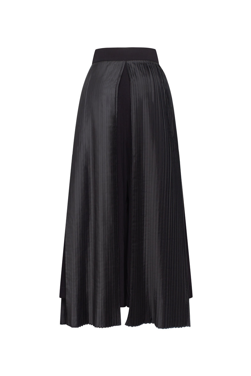 Black Tamar Keburia Ida culottes pants with wide-leg design and high waist, shown on a model.