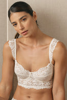 White vintage wired bustier bra from Ellipse Lingerie featuring lace details and supportive underwire, styled on a model.