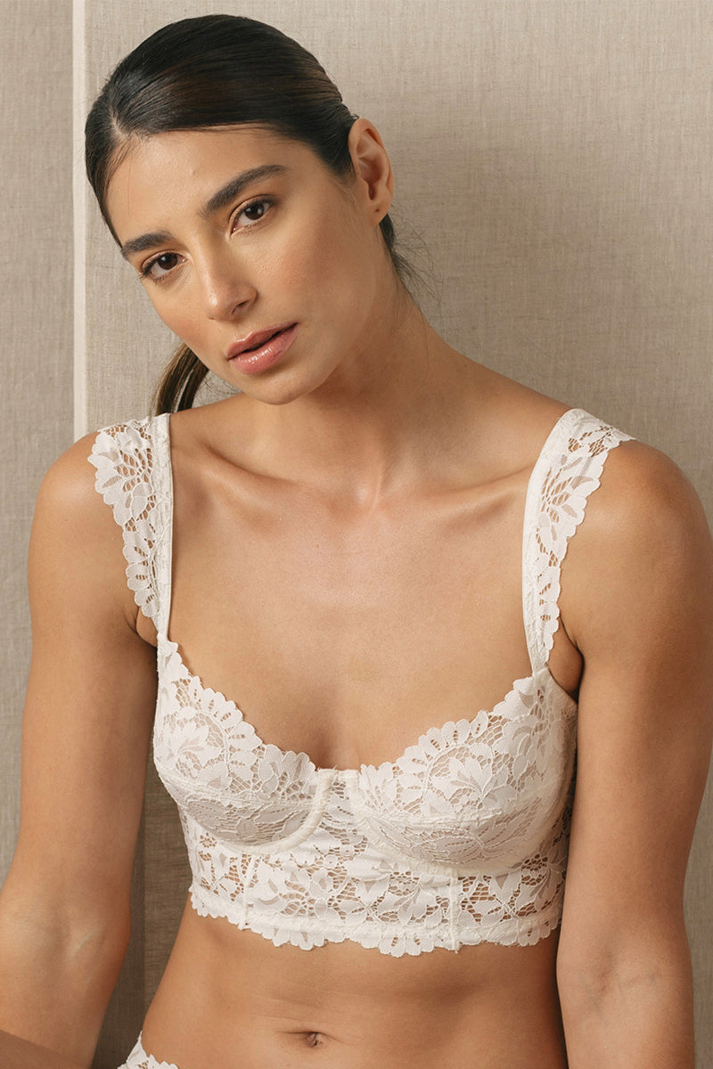White vintage wired bustier bra from Ellipse Lingerie featuring lace details and supportive underwire, styled on a model.