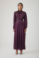 Elegant aubergine Indira embellished maxi dress by Mastani, featuring intricate embroidery and flowing fabric.