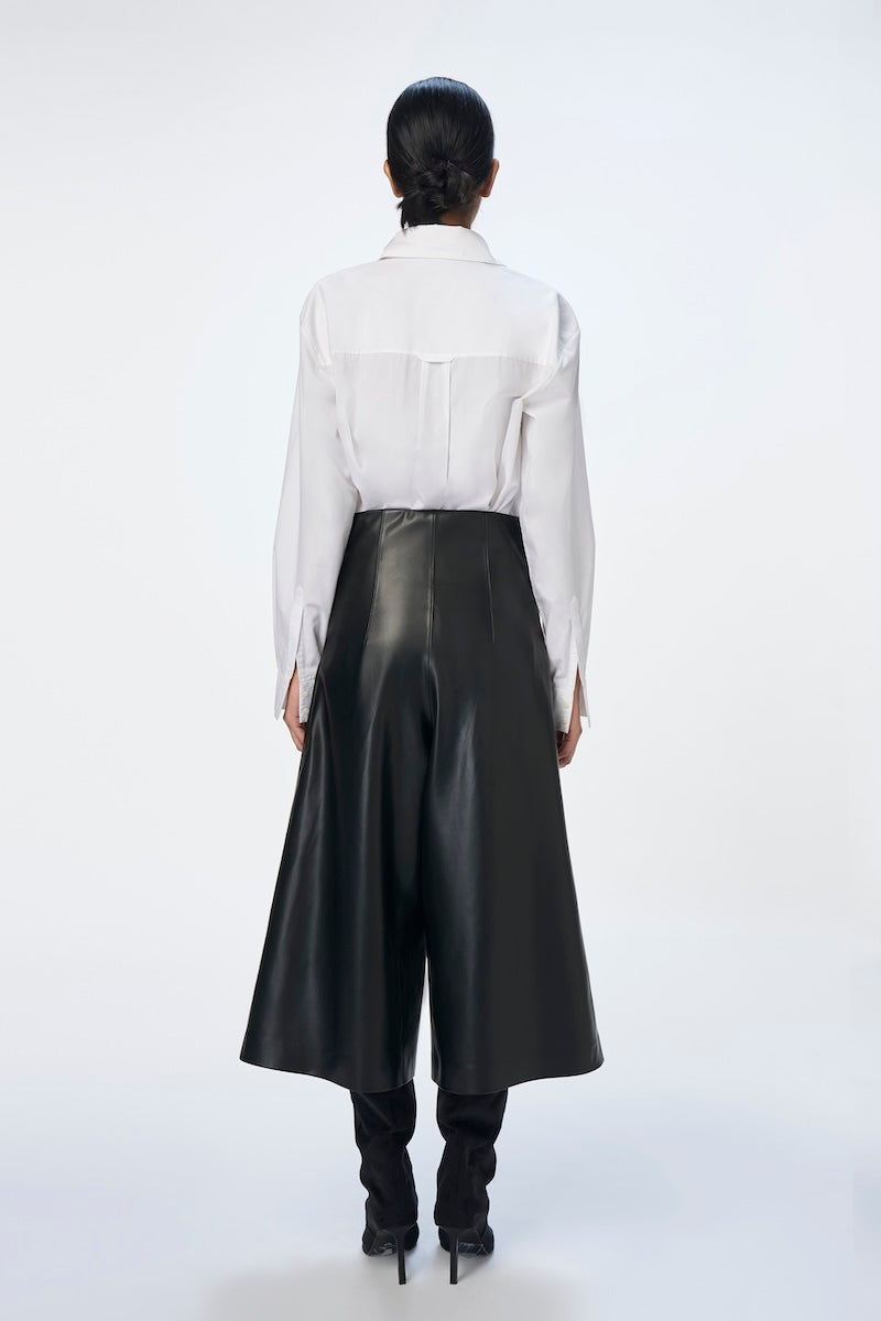 Black URA Inger Trousers, stylish pants with a tailored fit, displayed on a model showing the full length and design details.