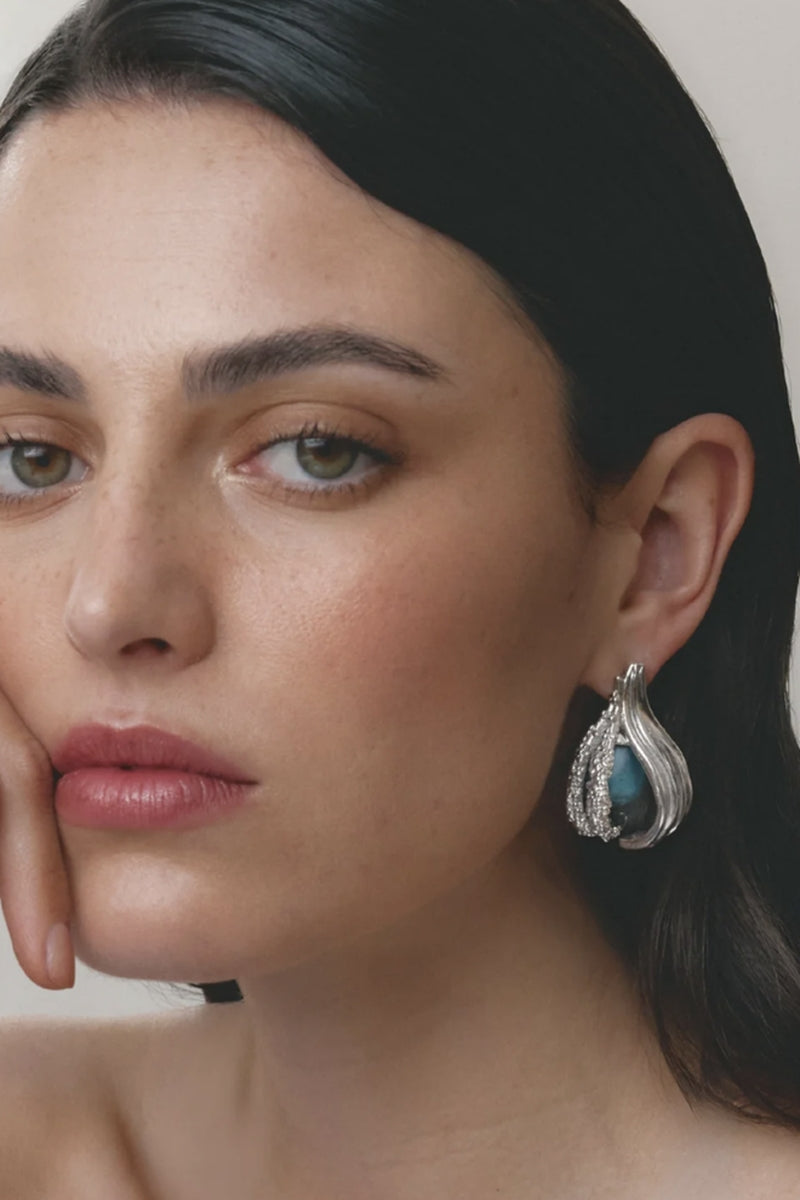Rhodium-plated blue interchangeable loop hoops earrings by Jude Benhalim, showcasing sleek circular design with a shiny finish.
