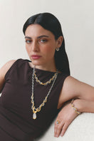 Jude Benhalim interchangeable bloom earrings with colorful floral designs on gold-tone hooks.