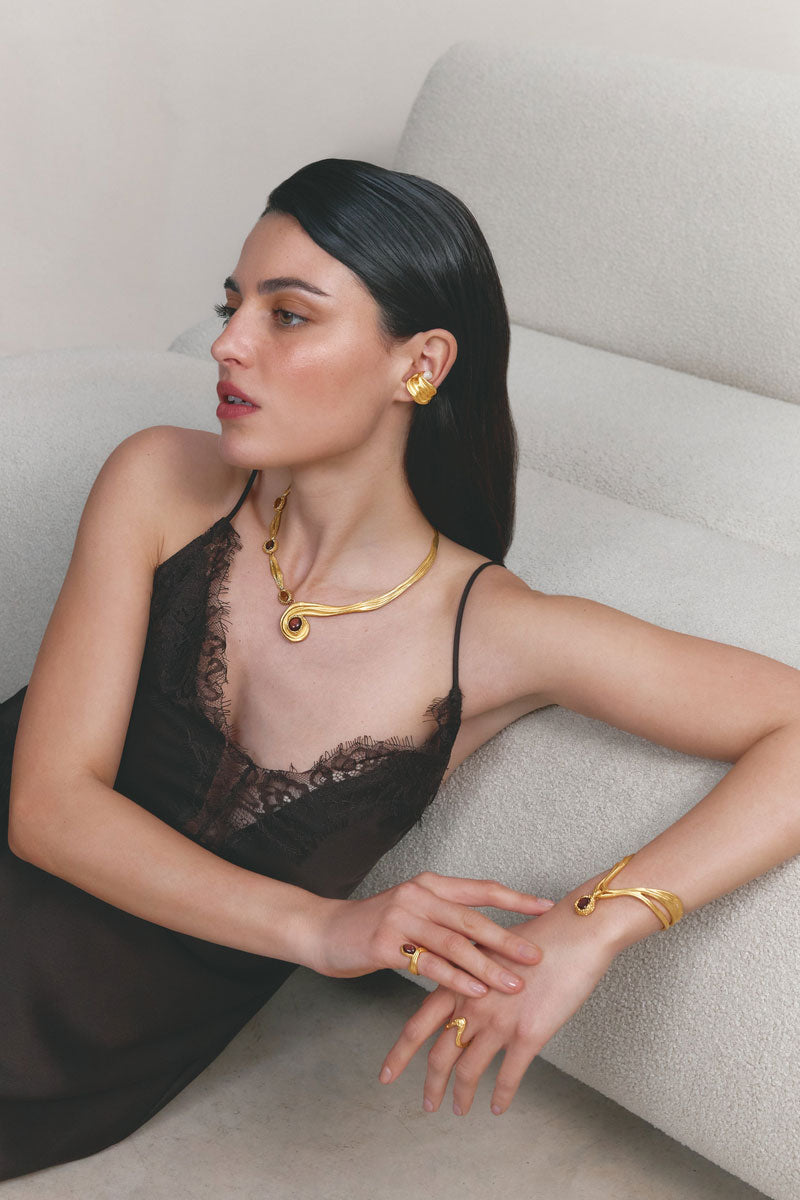 Gold and pearl interchangeable spiral necklace by Jude Benhalim, featuring a stylish spiral design with vibrant red accents.