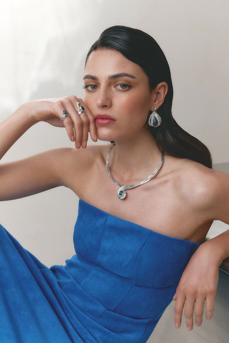 Silver and blue interchangeable loop hoop earrings by Jude Benhalim featuring spiral design.