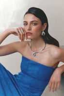 Silver and blue interchangeable loop hoop earrings by Jude Benhalim, featuring spiral design and versatile style.
