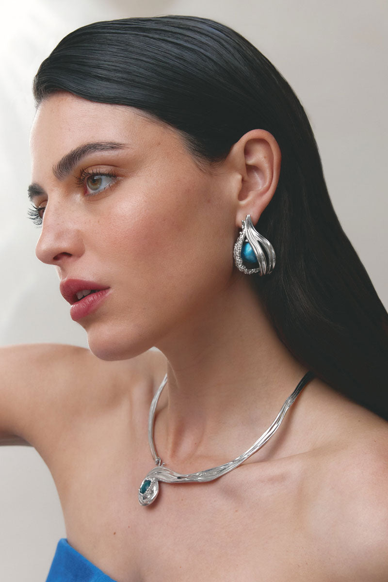 Silver and blue interchangeable loop hoop earrings by Jude Benhalim, featuring spiral design and versatile style.
