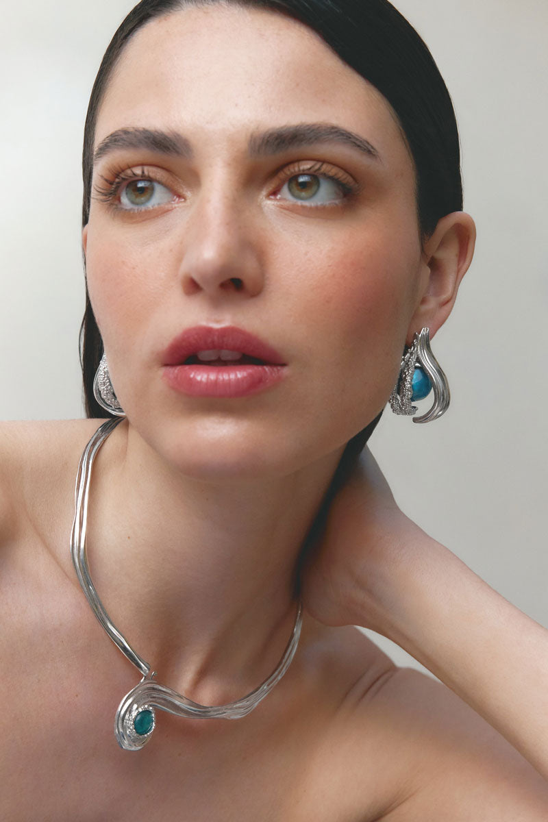 Silver and blue interchangeable loop hoop earrings by Jude Benhalim, featuring spiral design and modern jewelry style.