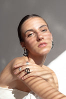 Salvárea Interconexión M earrings in smoky color featuring modern, interconnected design for stylish wear.