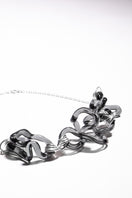 Salvária Interconexión Necklace in smoke-colored pendant, stylish jewelry piece showcasing a sleek, modern design.