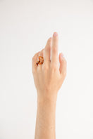 Set of three amber interconnection rings by SALVÁREA, featuring smooth, polished jewelry rings with intricate designs.