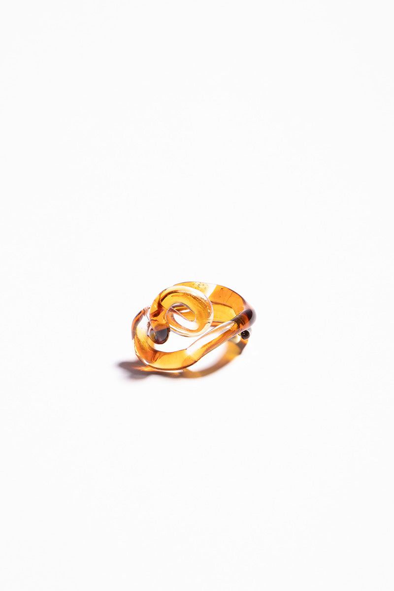 Set of interconnected amber rings by SALVÁREA featuring multiple stylish rings linked together in a unique jewelry design.