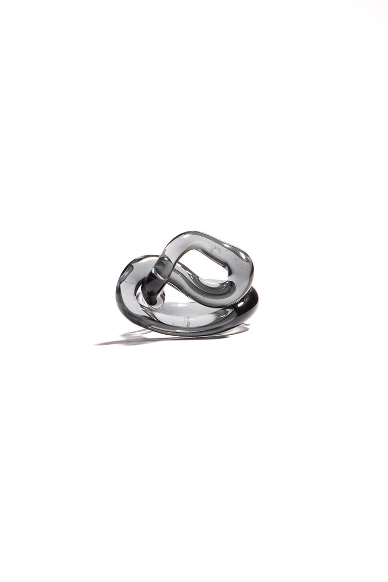 Set of SALVÁREA interconnection rings in smoky design, showcasing stylish layered rings on a neutral background.
