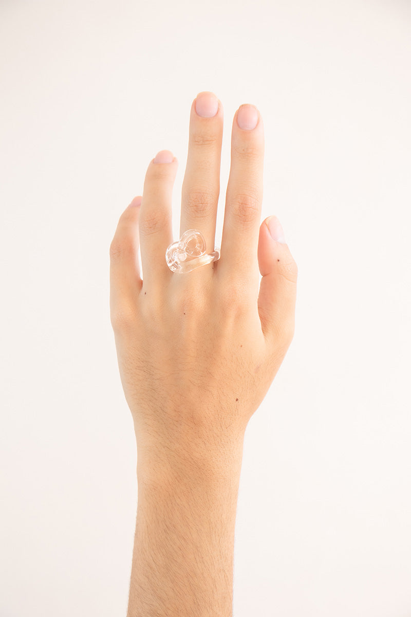 Set of transparent interconnection rings from SALVÁREA, showcasing multiple rings linked together for versatile jewelry design.