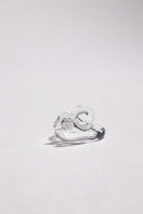 Set of transparent interconnection rings from SALVÁREA, showcasing interconnected rings in a clear, modern design.