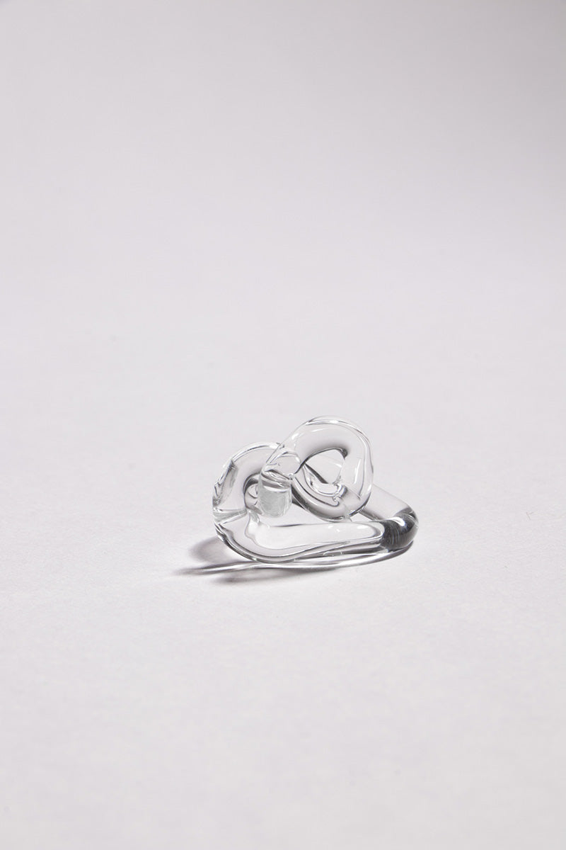 Set of transparent interconnection rings from SALVÁREA, showcasing interconnected rings in a clear, modern design.