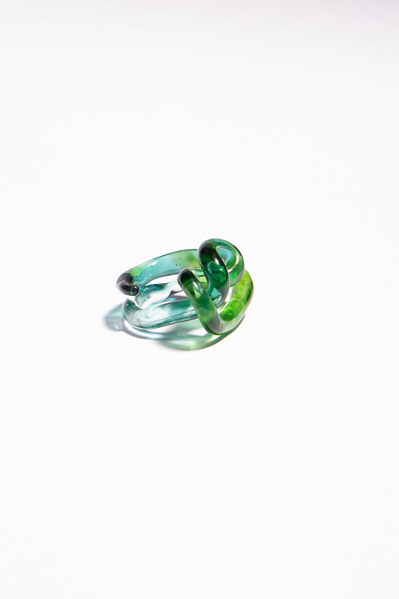 Set of green SALVÁREA interconnection rings, showcasing multiple interconnected rings in a close-up image.
