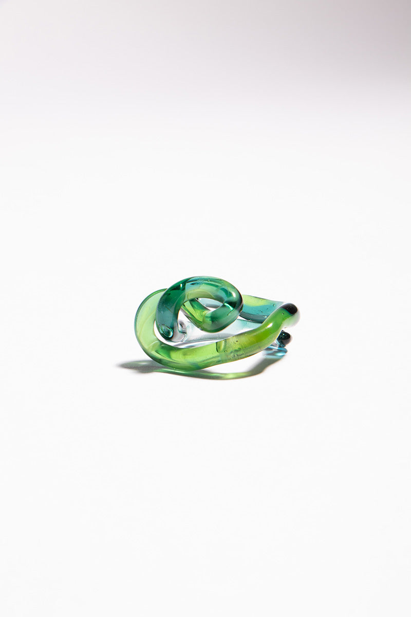 Set of green SALVÁREA interconnection rings, showcasing multiple interconnected rings in a vibrant green color.