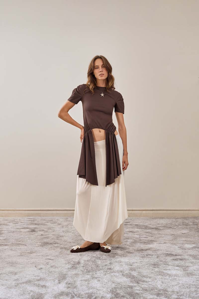 Ivory YASSMIN SALEH intersect midi skirt with a sleek, fitted design, front view showcasing its elegant and modern style.