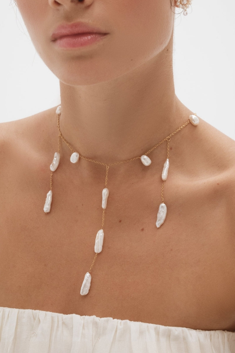 LAVANI JEWELS Iris Pearl Necklace featuring elegant white pearls and delicate chain for sophisticated style.