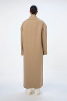 Gray ISA coat by URA, stylish outerwear with a tailored fit, displayed on a hanger.
