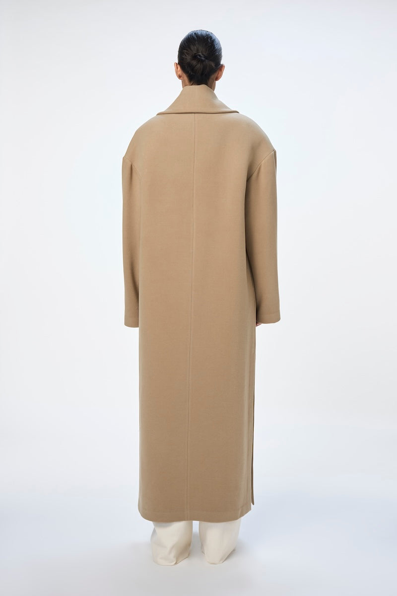 Gray ISA coat by URA, stylish outerwear with a tailored fit, displayed on a hanger.