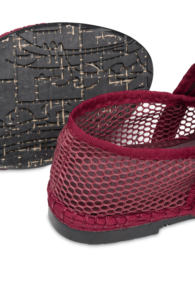 Flabelus Isabella Garnet flats with garnet piping, showcasing elegant red slip-on shoes with detailed stitching and smooth finish.