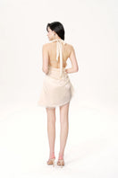 Nana Jacqueline Isadora mini dress in light champagne, elegant sleeveless design with a fitted silhouette and subtle shimmer.