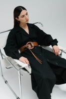 Brown Isidora Malva Belen belt with sleek design and buckle, displayed on a neutral background.