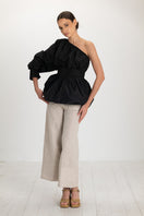 Black Isolde top by ANA + MARIA, stylish sleeveless blouse with a fitted design, shown in high-resolution image.