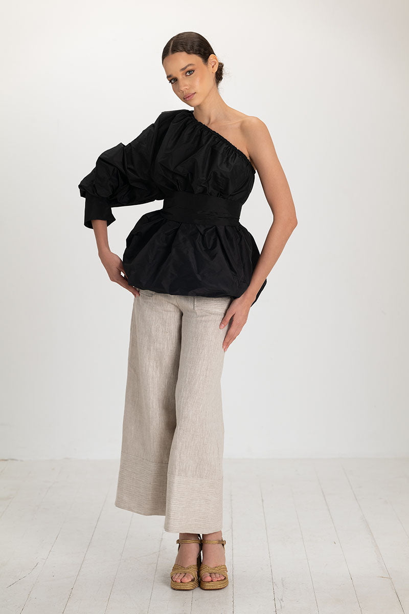 Black Isolde top by ANA + MARIA, stylish sleeveless blouse with a fitted design, shown in high-resolution image.