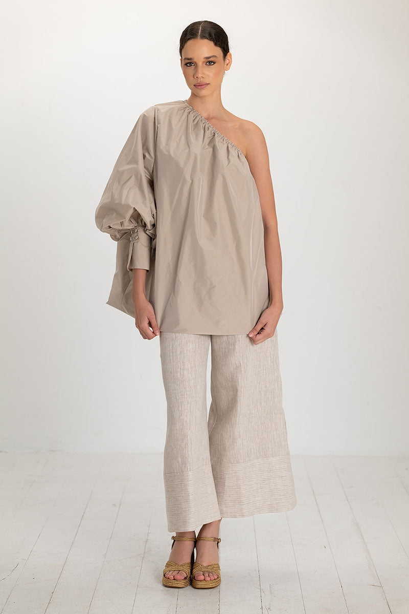 ANA + MARIA Isolde Smoke Gray top displayed on a hanger with a fitted, stylish design and soft fabric.