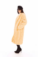 Nana Jacqueline Isolde faux fur long coat displayed on a model, featuring plush texture and elegant winter style.