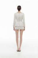 Ivory brocade blazer by Montsand paired with matching skirt, stylish formal blazer with intricate woven pattern.