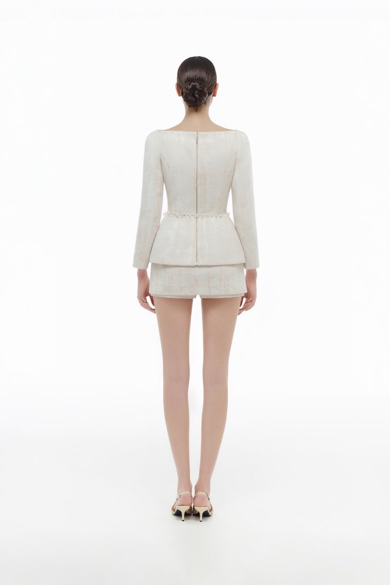 Ivory brocade blazer by Montsand paired with matching skirt, stylish formal blazer with intricate woven pattern.