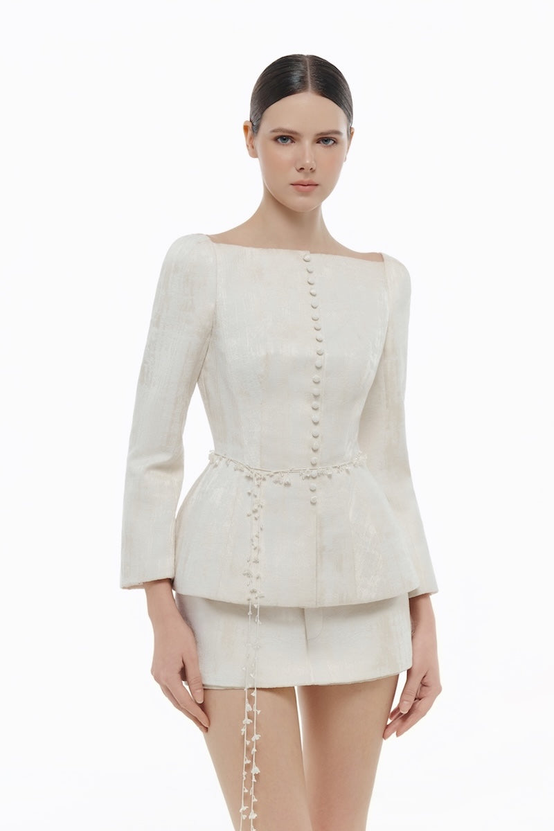 Ivory brocade blazer from Montsand, stylish tailored blazer with intricate patterned fabric, shown with matching skirt.