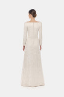 Ivory brocade split gown by Montsand featuring elegant fabric and a flowing design, perfect for formal occasions.