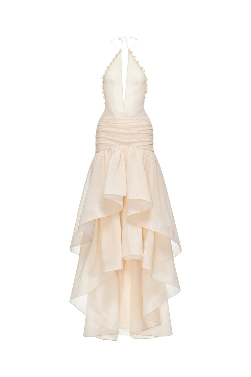 Ivory cut-out halter maxi dress by Montsand featuring a flowing silhouette and stylish cut-out details.