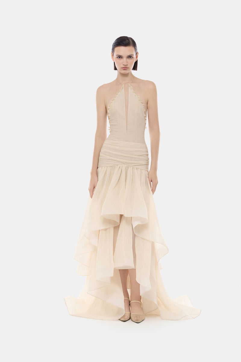 Ivory cut-out halter maxi dress by Montsand featuring a flowing silhouette and stylish open back design.