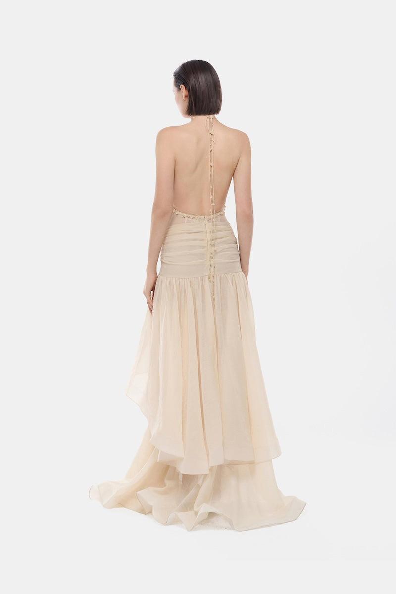 Ivory cut-out halter maxi dress by Montsand featuring a flowing silhouette and stylish design, perfect for elegant occasions.