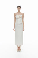 Ivory draped tube midi dress by Montsand, featuring elegant fabric and sleek fit, perfect for formal occasions.
