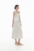 Ivory floral bustier midi dress by Montsand, featuring a fitted bodice and flowing skirt for elegant, feminine style.