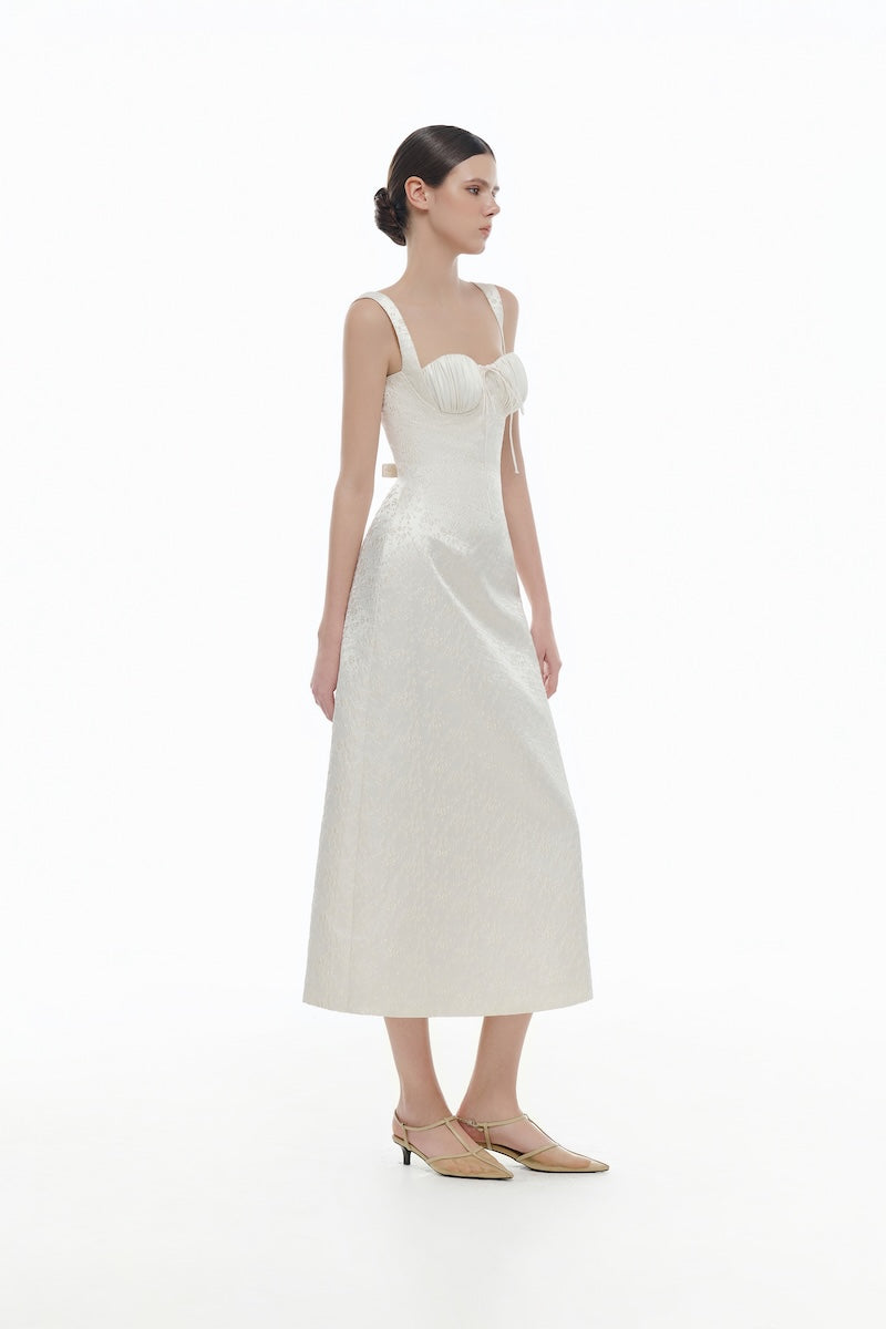 Ivory floral bustier midi dress by Montsand, featuring a fitted bodice and flowing skirt for elegant, feminine style.